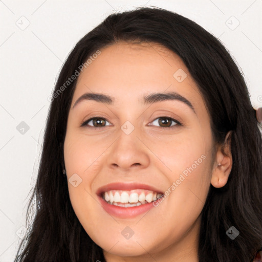 Joyful white young-adult female with long  brown hair and brown eyes