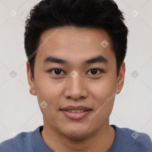 Joyful asian young-adult male with short  black hair and brown eyes