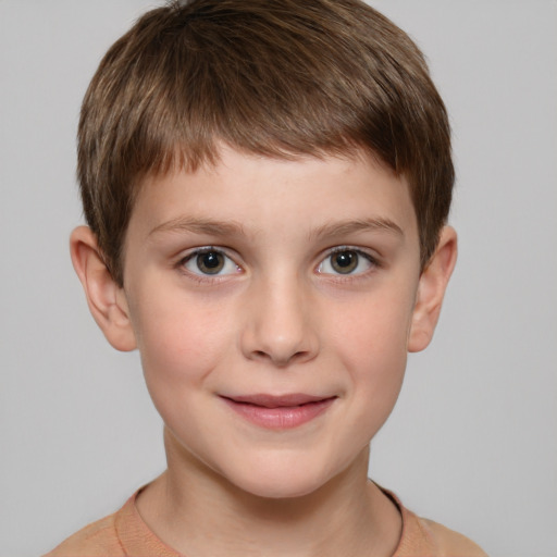 Joyful white child male with short  brown hair and grey eyes