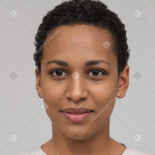 Joyful black young-adult female with short  black hair and brown eyes