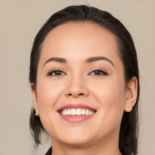 Joyful white young-adult female with medium  brown hair and brown eyes