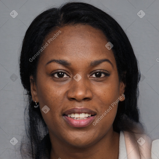 Joyful black young-adult female with long  black hair and brown eyes