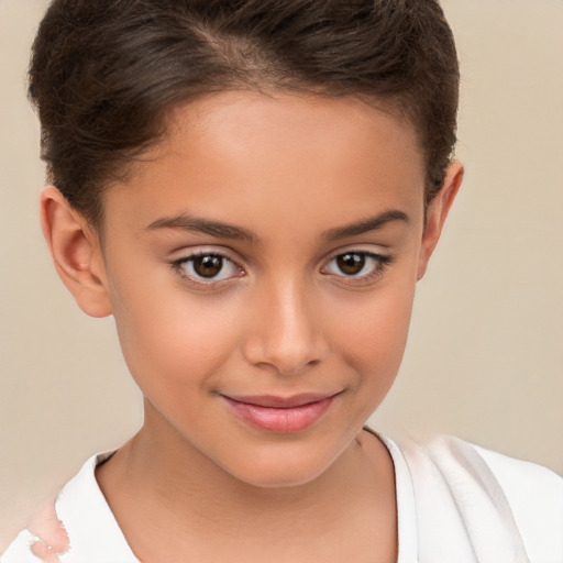 Joyful white child female with short  brown hair and brown eyes