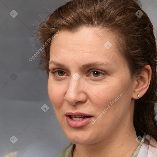 Joyful white adult female with medium  brown hair and grey eyes