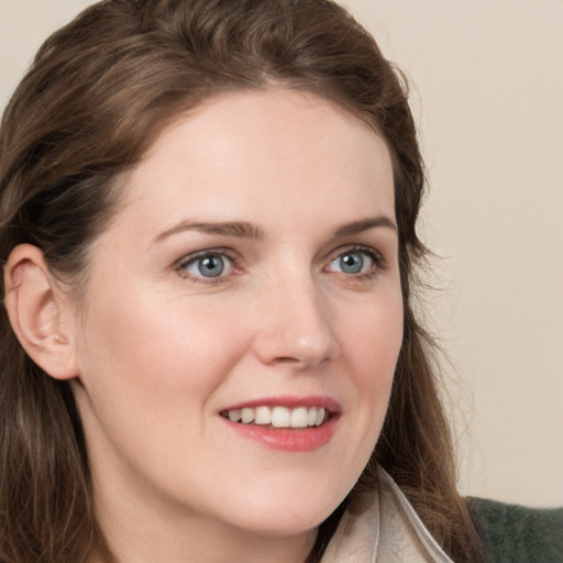 Joyful white young-adult female with long  brown hair and grey eyes