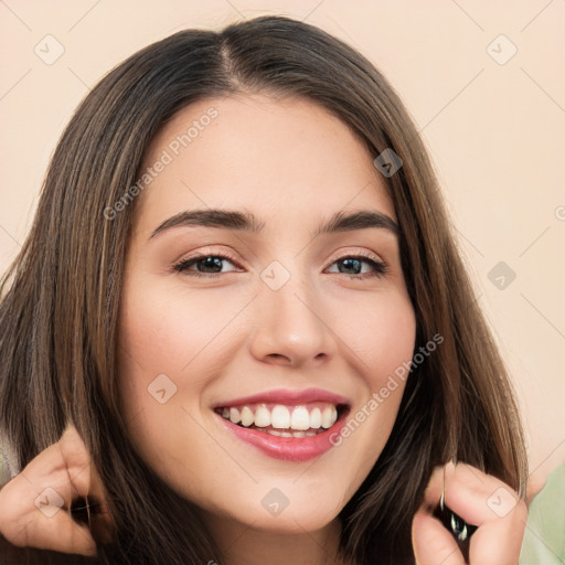 Joyful white young-adult female with long  brown hair and brown eyes