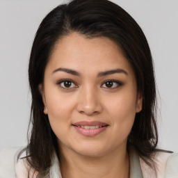 Joyful latino young-adult female with medium  brown hair and brown eyes