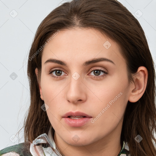 Neutral white young-adult female with long  brown hair and brown eyes