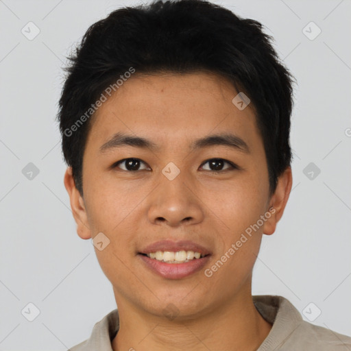 Joyful asian young-adult male with short  brown hair and brown eyes