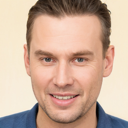 Joyful white young-adult male with short  brown hair and brown eyes