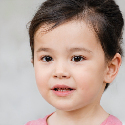 Joyful white child male with medium  brown hair and brown eyes