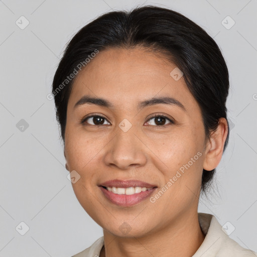 Joyful latino young-adult female with medium  brown hair and brown eyes