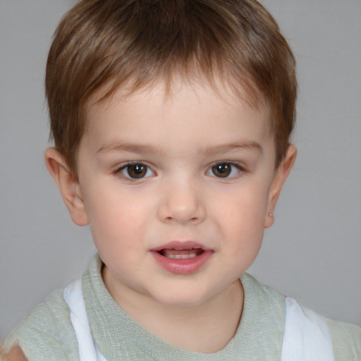 Joyful white child male with short  brown hair and brown eyes