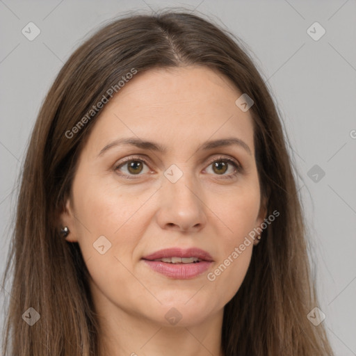 Joyful white adult female with long  brown hair and brown eyes