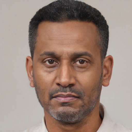Neutral latino adult male with short  black hair and brown eyes