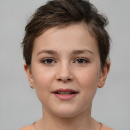 Joyful white child female with short  brown hair and brown eyes