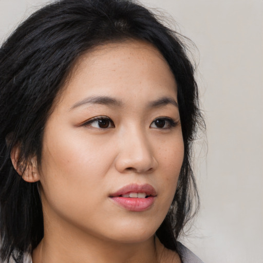Neutral asian young-adult female with medium  brown hair and brown eyes