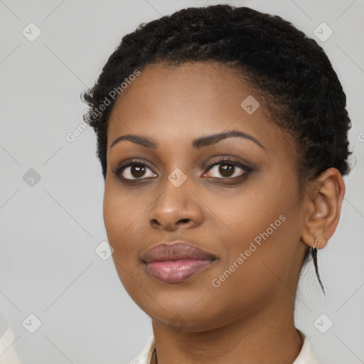 Joyful black young-adult female with short  brown hair and brown eyes