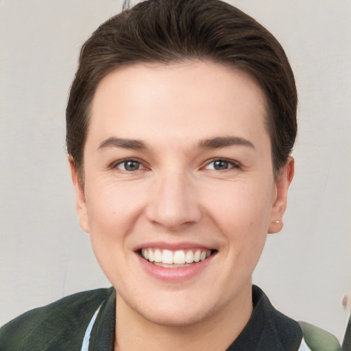 Joyful white young-adult female with short  brown hair and brown eyes