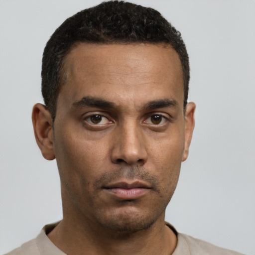Neutral white young-adult male with short  black hair and brown eyes