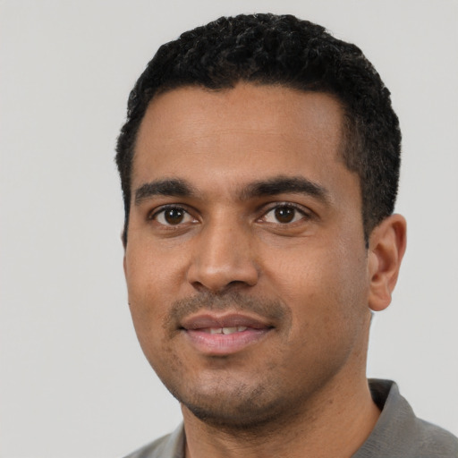 Neutral black young-adult male with short  black hair and brown eyes