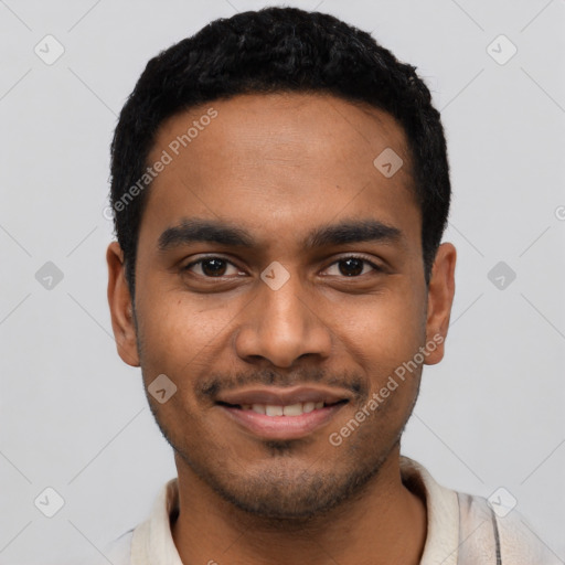 Joyful black young-adult male with short  black hair and brown eyes