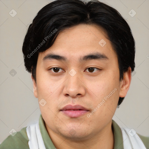 Joyful asian young-adult male with short  black hair and brown eyes