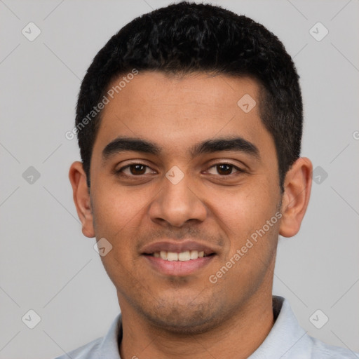 Joyful latino young-adult male with short  black hair and brown eyes