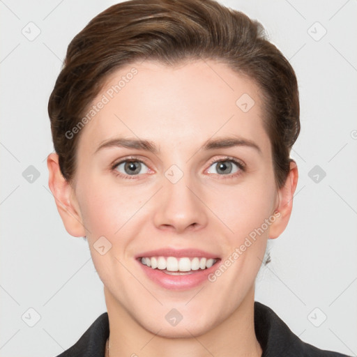 Joyful white young-adult female with short  brown hair and grey eyes