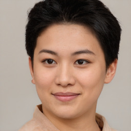 Joyful asian young-adult female with short  brown hair and brown eyes