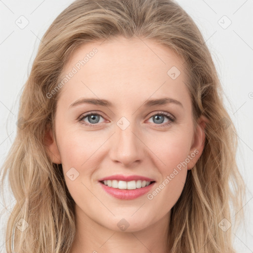 Joyful white young-adult female with long  brown hair and blue eyes