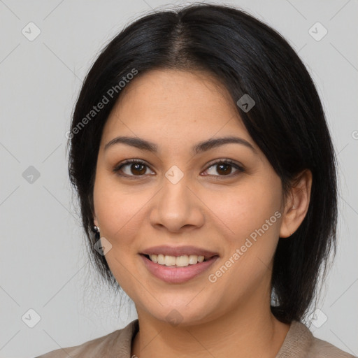 Joyful latino young-adult female with medium  black hair and brown eyes