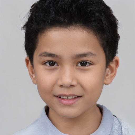 Joyful white child male with short  brown hair and brown eyes