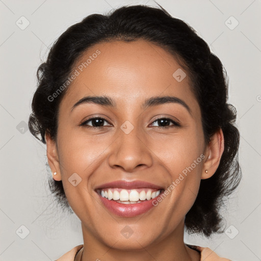 Joyful latino young-adult female with medium  brown hair and brown eyes