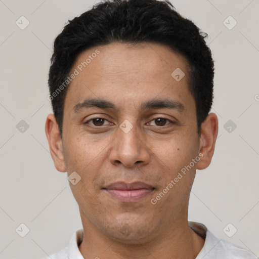 Joyful white young-adult male with short  black hair and brown eyes