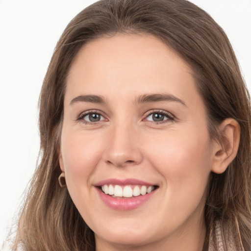 Joyful white young-adult female with long  brown hair and grey eyes