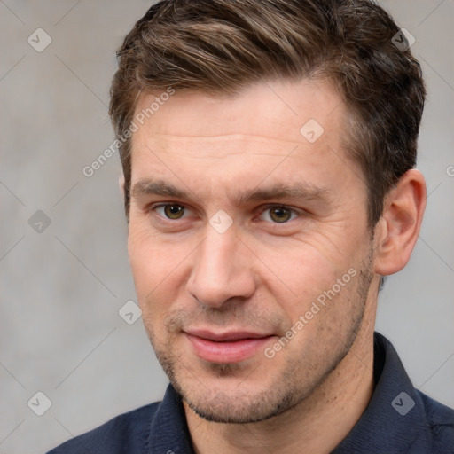 Joyful white adult male with short  brown hair and brown eyes