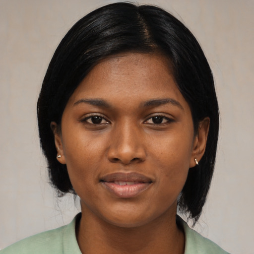 Joyful asian young-adult female with medium  black hair and brown eyes