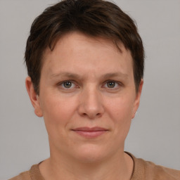 Joyful white adult female with short  brown hair and brown eyes