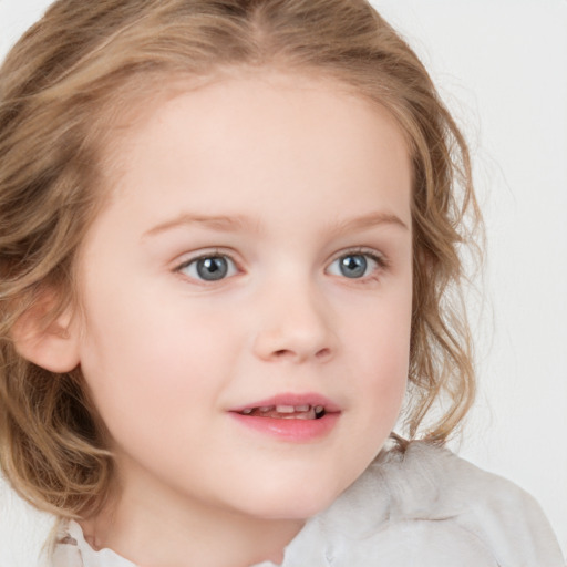 Joyful white child female with medium  brown hair and blue eyes