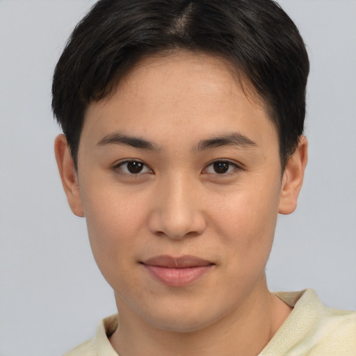 Joyful asian young-adult female with short  brown hair and brown eyes