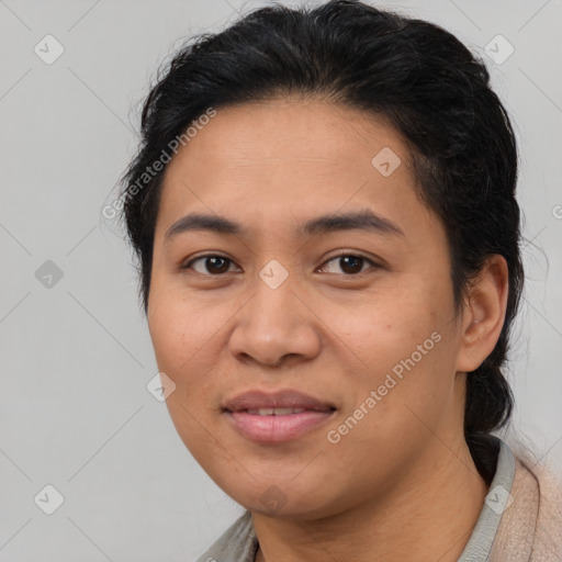 Joyful asian young-adult female with short  brown hair and brown eyes