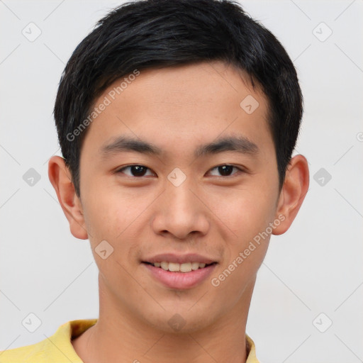 Joyful asian young-adult male with short  brown hair and brown eyes