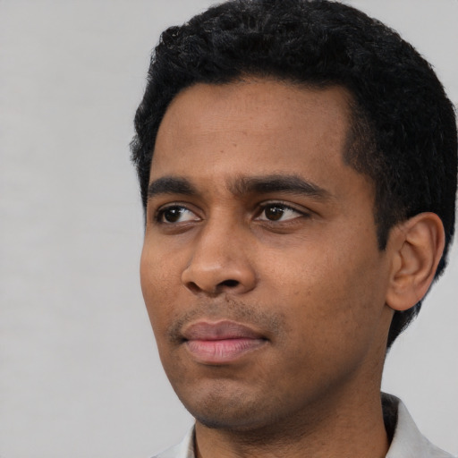Neutral latino young-adult male with short  black hair and brown eyes