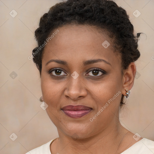 Joyful black young-adult female with short  brown hair and brown eyes