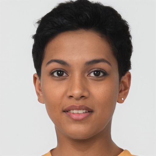 Joyful latino young-adult female with short  black hair and brown eyes