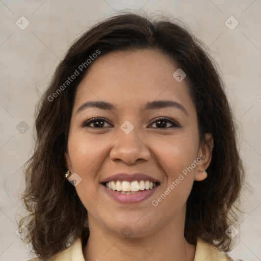 Joyful latino young-adult female with medium  brown hair and brown eyes