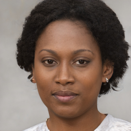 Neutral black young-adult female with short  black hair and brown eyes