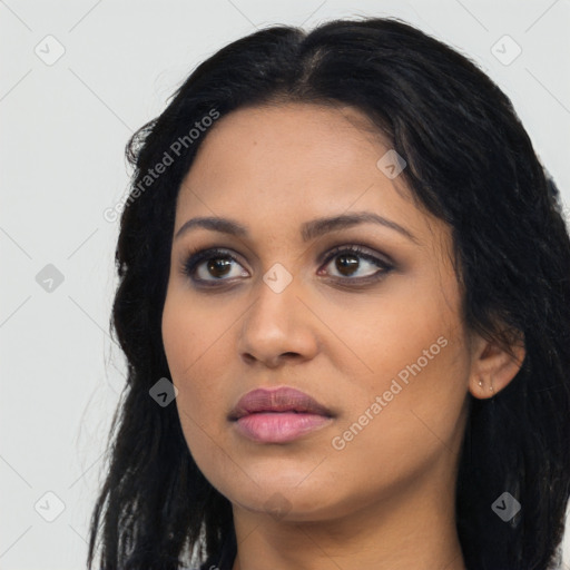 Joyful latino young-adult female with long  black hair and brown eyes