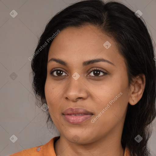 Joyful latino young-adult female with long  black hair and brown eyes